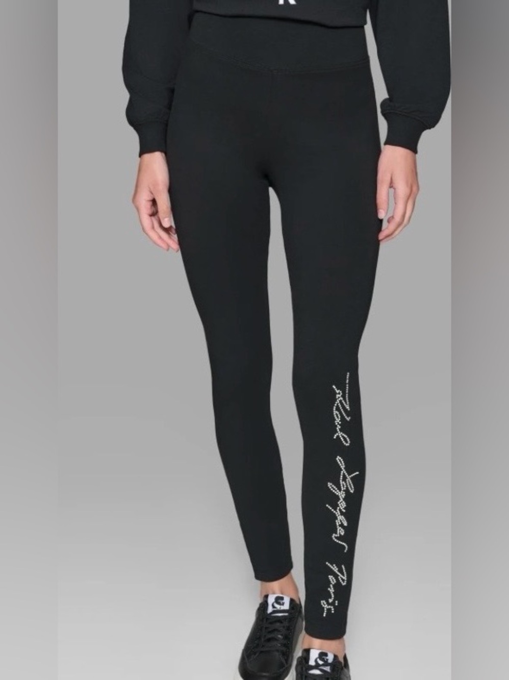 Karl Lagerfeld Paris. black athleisure leggings feature a distinct cursive signa